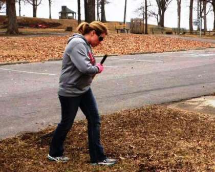 Amy Harper-Hogancamp raking leaves at Columbus Belmont State Park